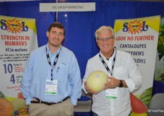 BJ Milligan and Bernie Henderson with Sol Group Marketing. Bernie shows a Honeydew melon from Guatemala. Product from Honduras will be available in about three weeks.